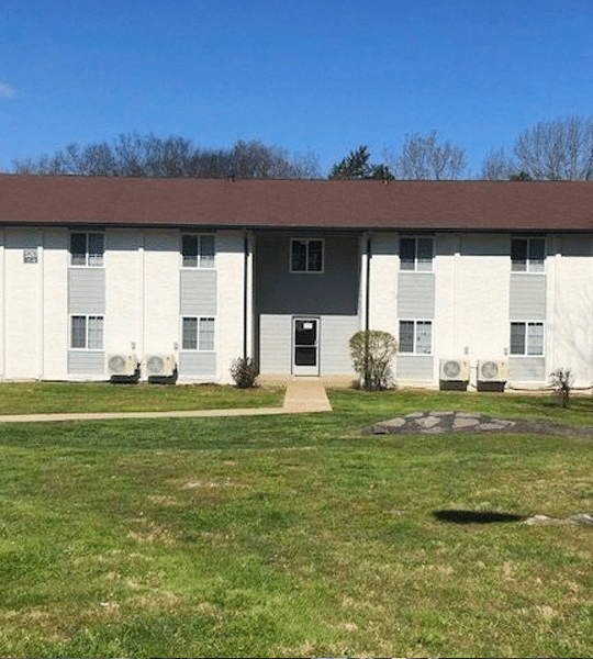 the apartment building is located in a grassy area at The North Park