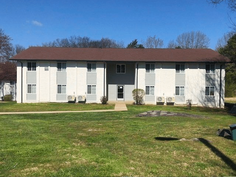 the apartment building is located in a grassy area at The North Park