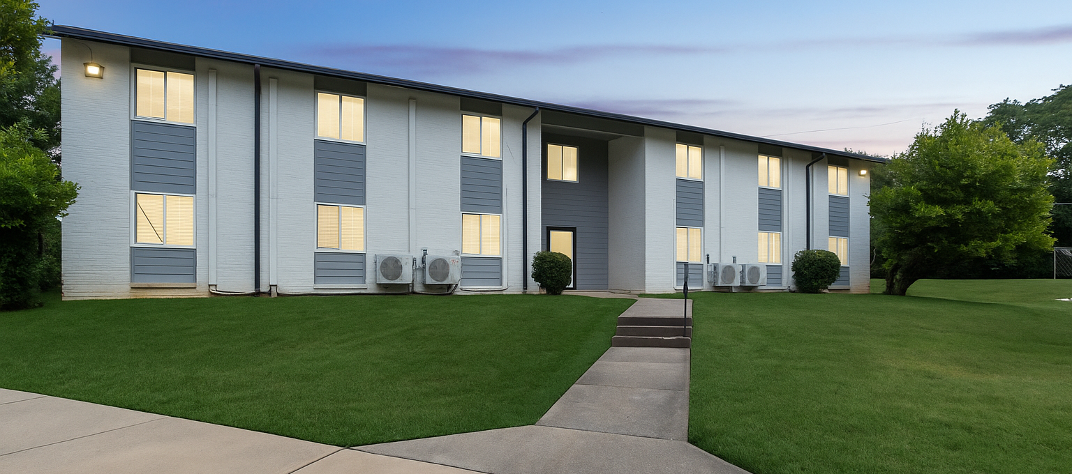 a large white building with a blue roof