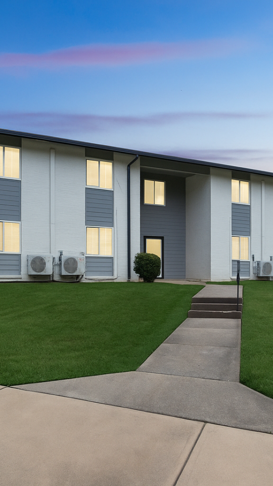 a large white building with a blue roof